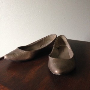 Pointy toe flats in a metallic neutral.